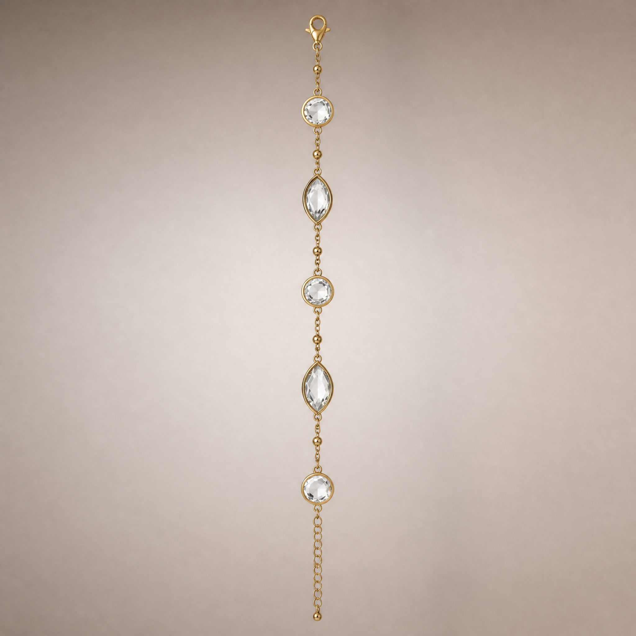 Gold crystal station bracelet with round & marquise clear stones