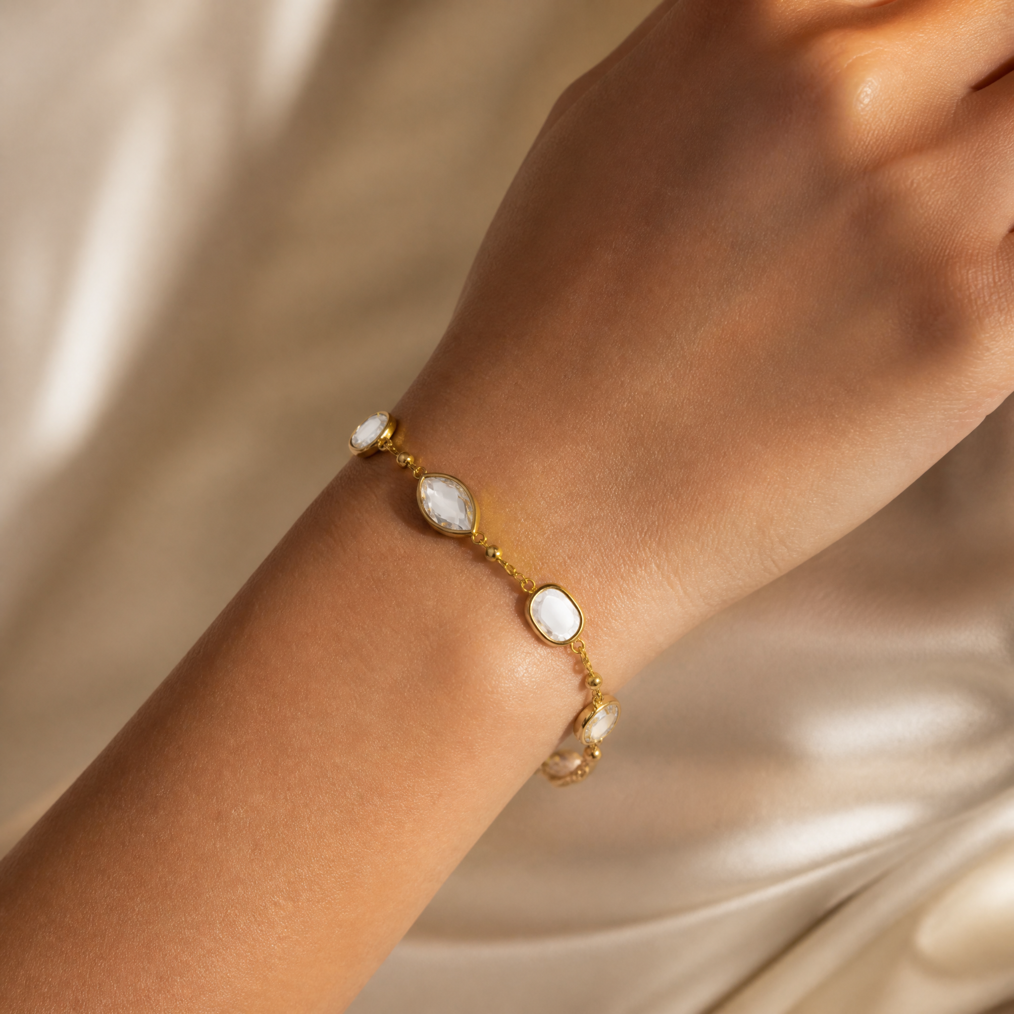 Gold crystal station bracelet with round & marquise clear stones