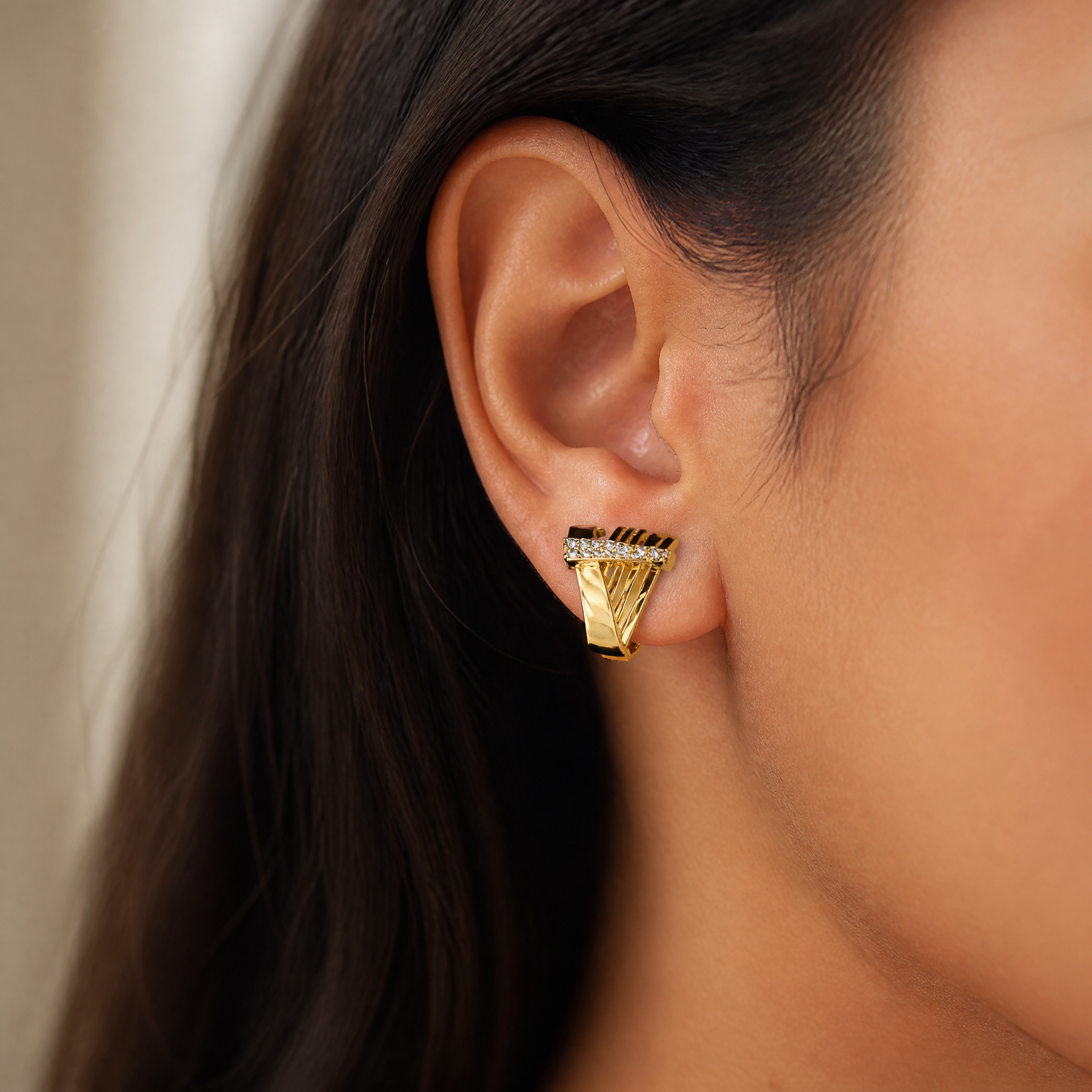 Gold fan pave huggie earrings