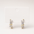 Gold & silver tone crystal baguette crossover huggie earrings