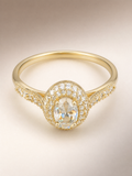 Gold oval crystal halo ring with pave shoulders