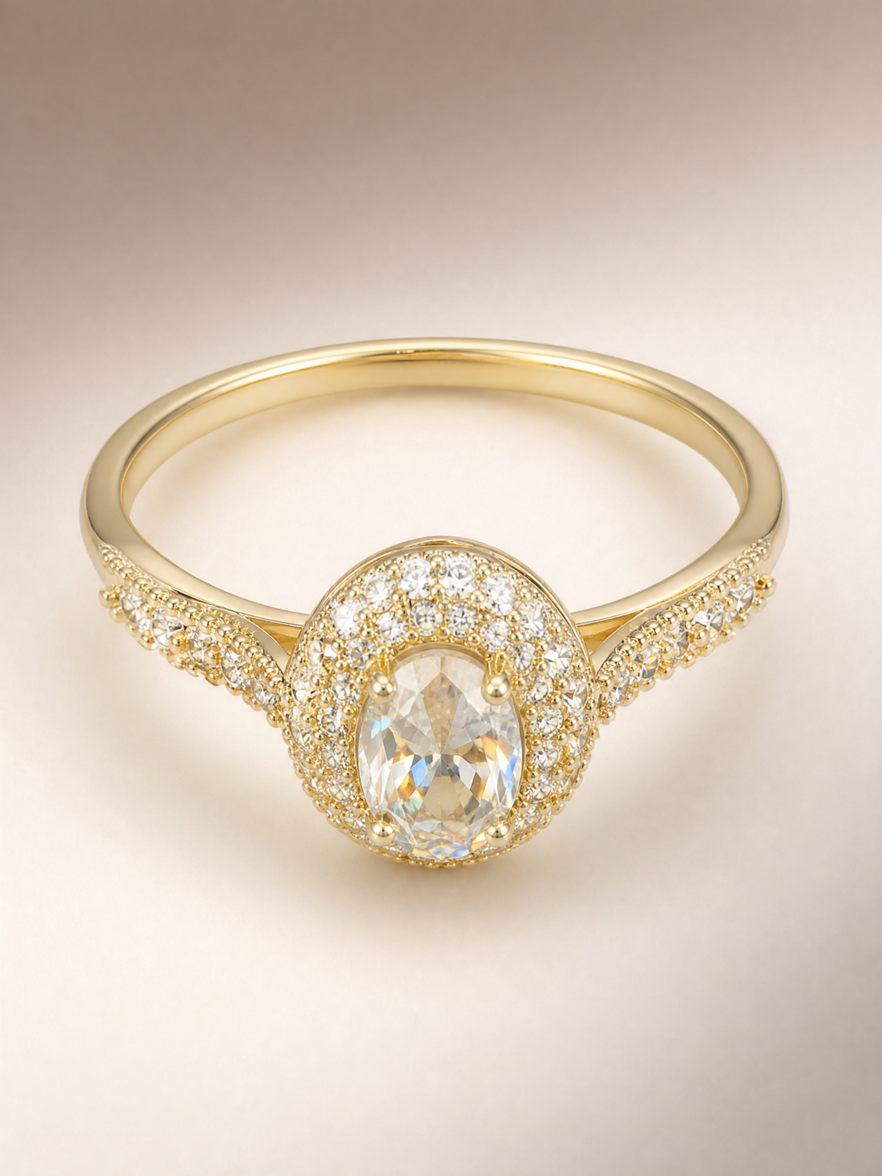 Gold oval crystal halo ring with pave shoulders