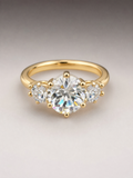 Gold three stone oval crystal ring