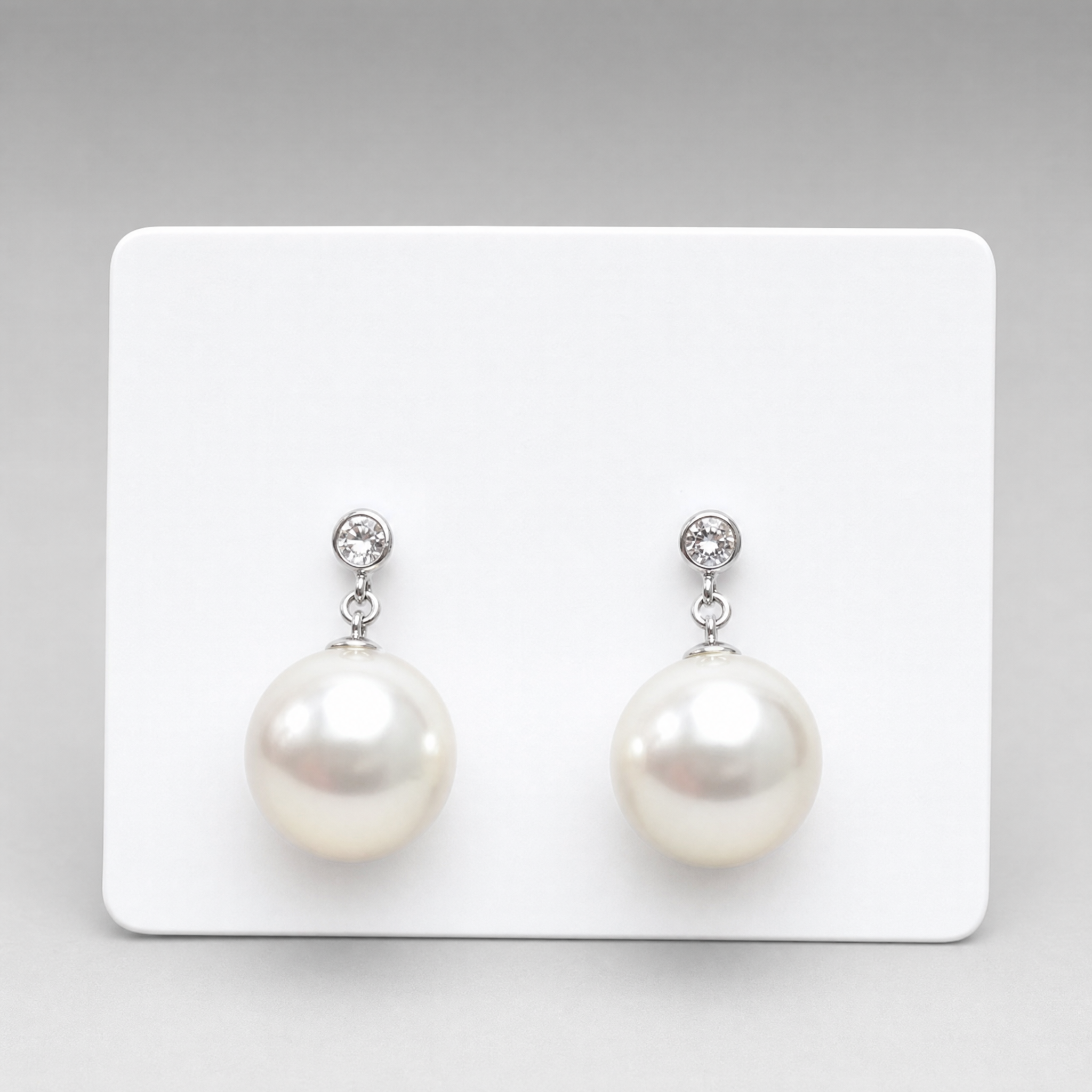 Silver tone crystal stud white pearl drop earrings