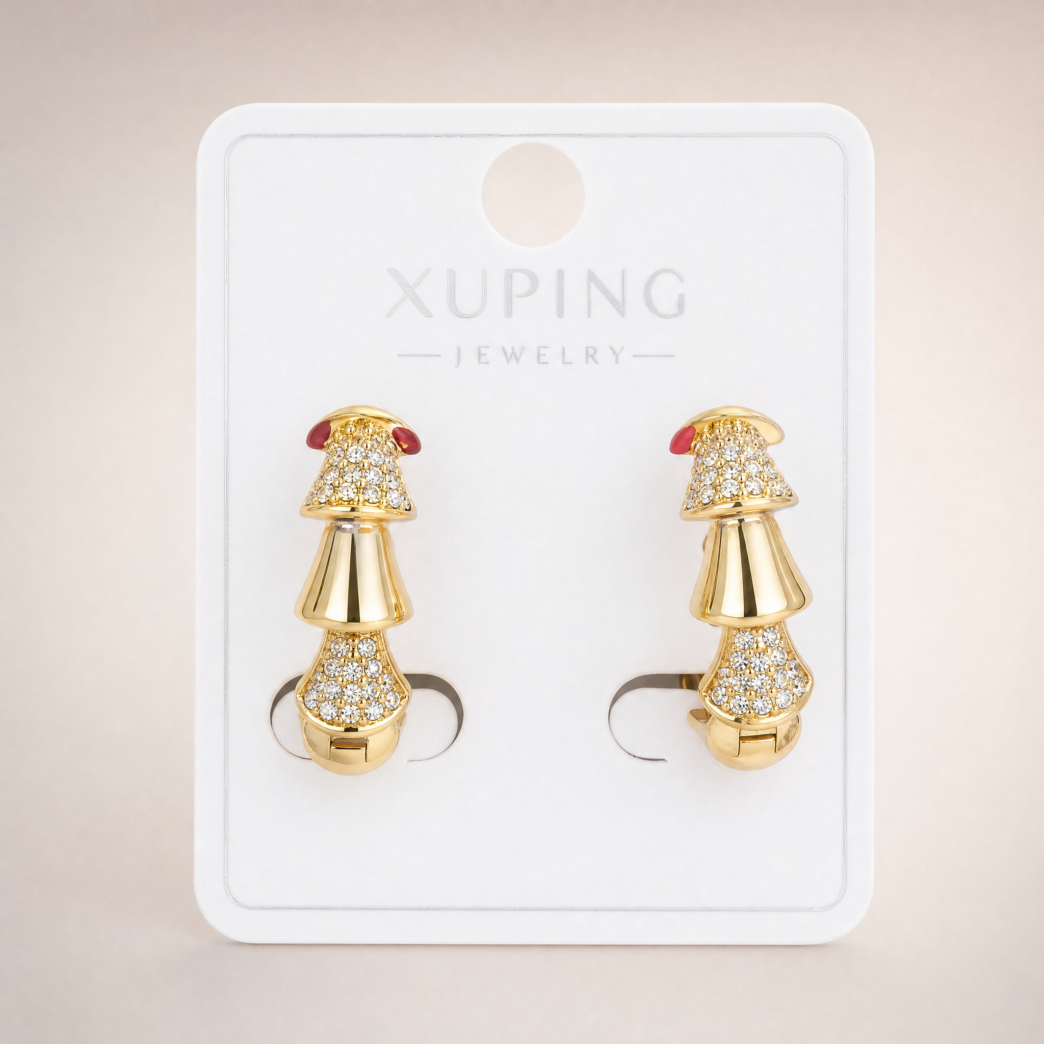 Gold tone pave crystal tiered drop huggie earrings