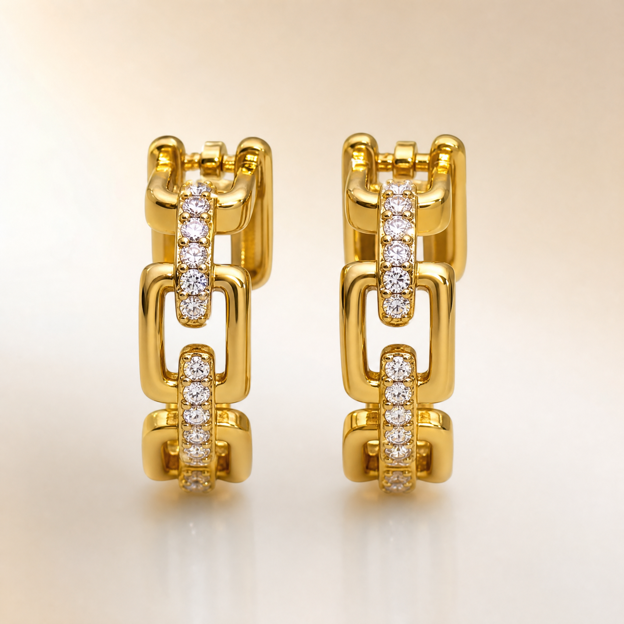 Gold tone pave crystal chain link huggie earrings