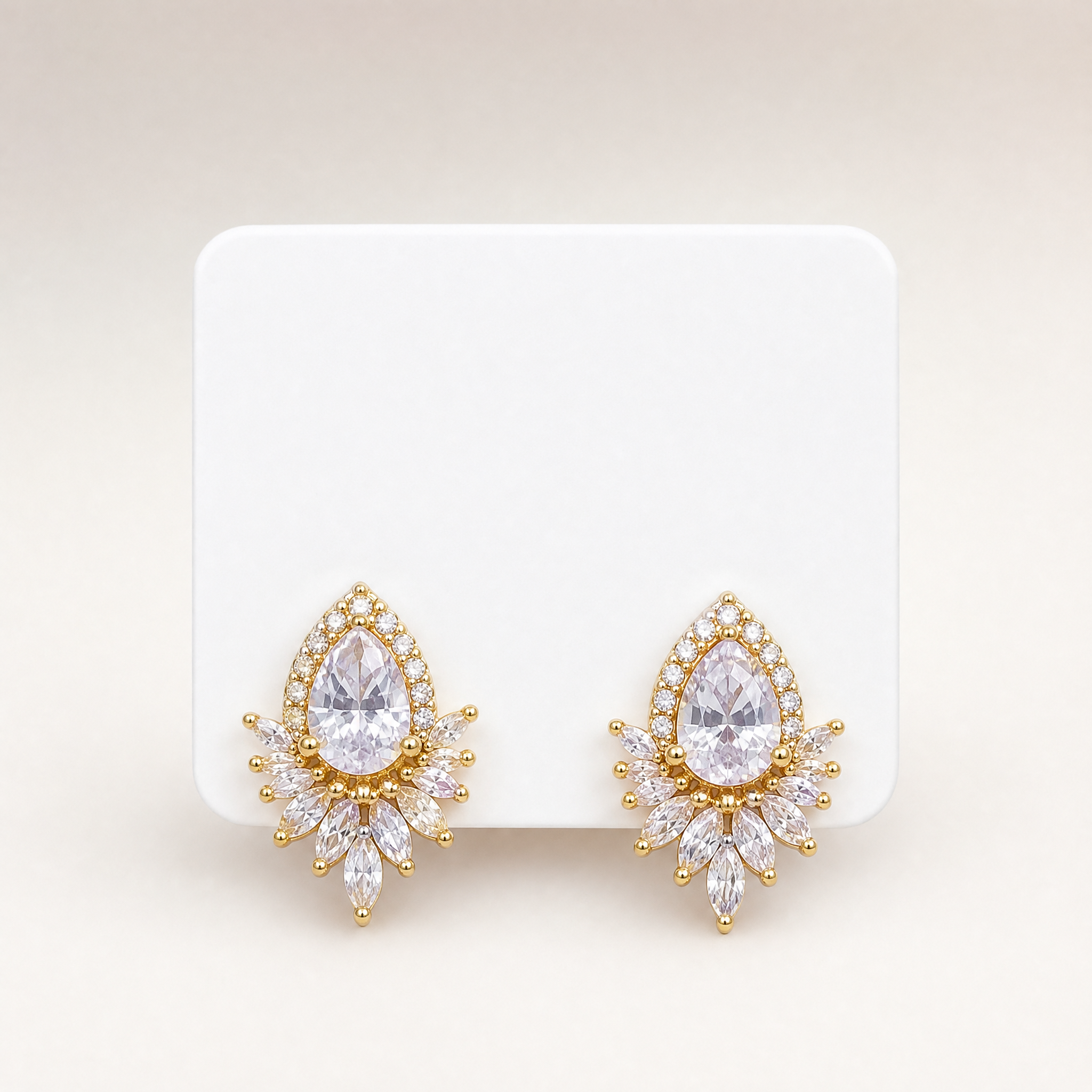 Gold tone teardrop crystal cluster stud earrings