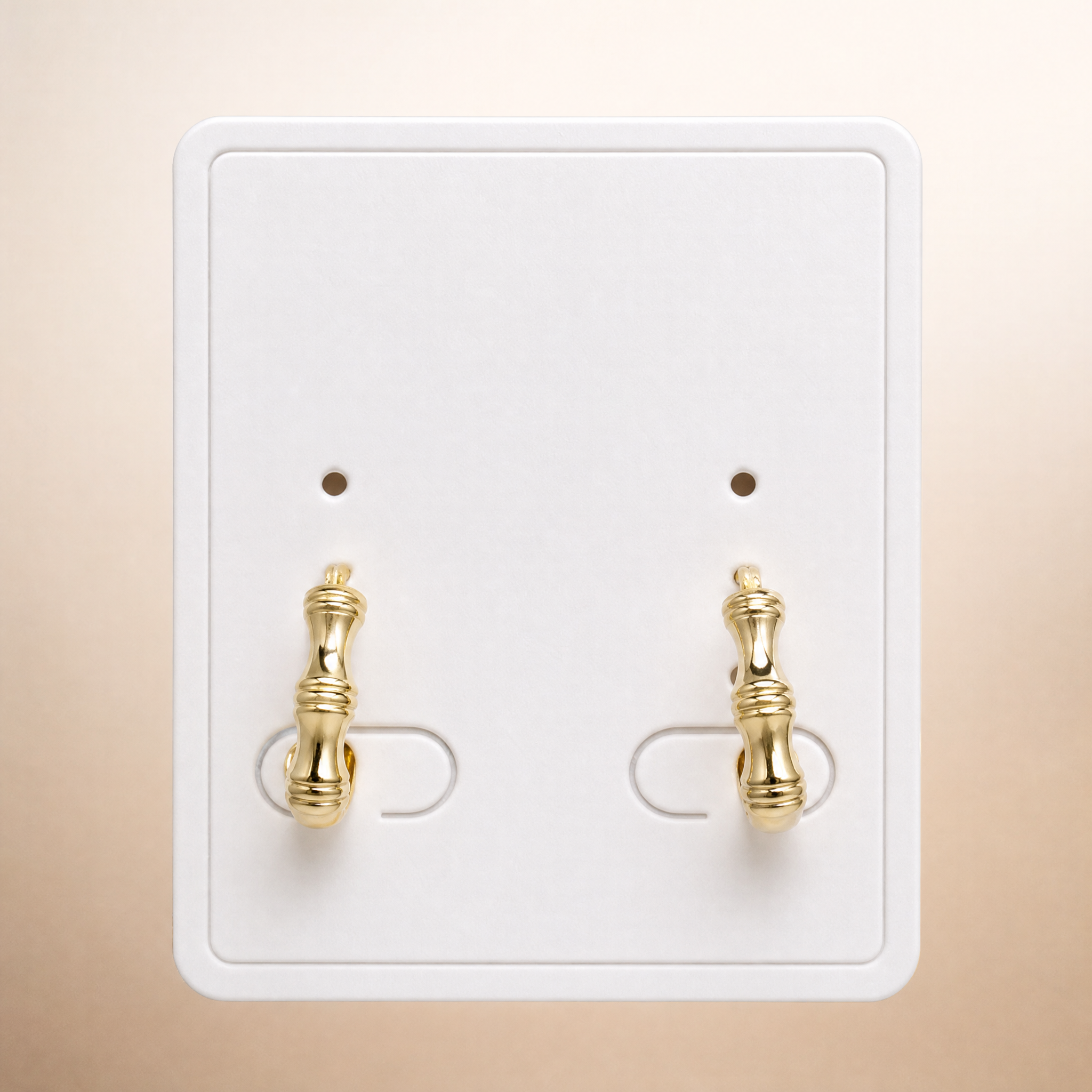 Gold tone polished bamboo huggie hoop earrings