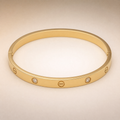 Gold Screw-Motif Bangle – worn