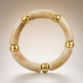 Cream-marble curved-tube stretch bracelet, gold spacers