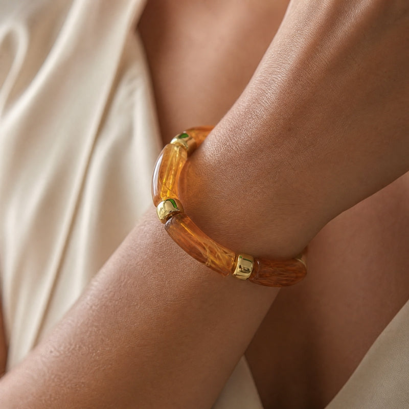 Amber-marble curved-tube stretch bracelet, gold spacers