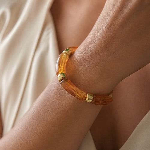 Amber-marble curved-tube stretch bracelet, gold spacers