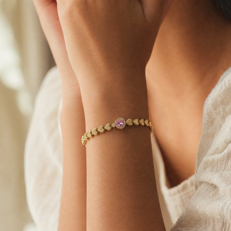 Gold heart-link bracelet, pink heart CZ centre