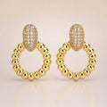Gold CZ pavé oval-top ribbed circle drop earrings