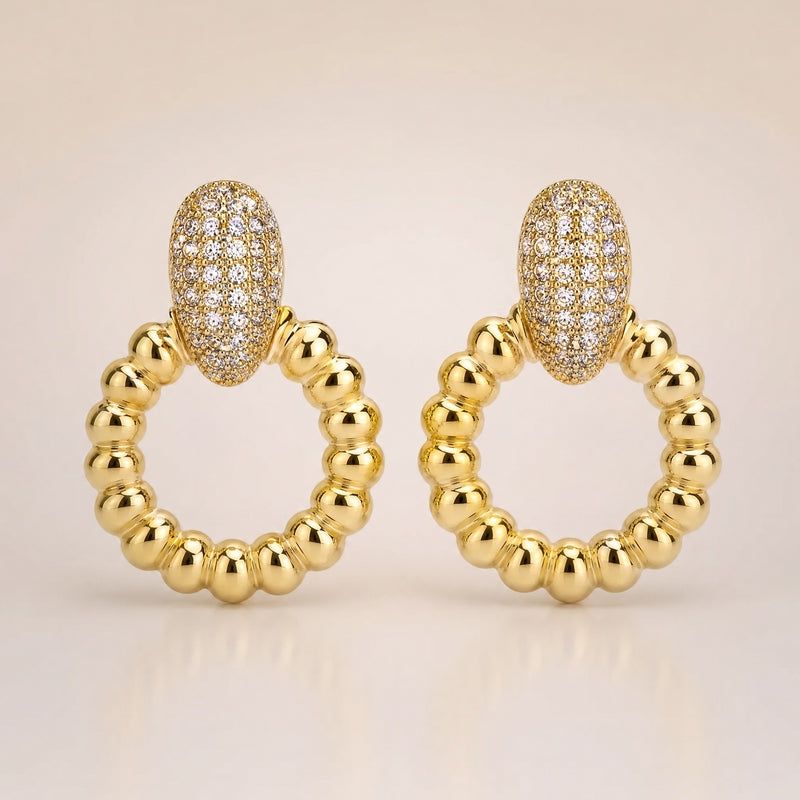 Gold CZ pavé oval-top ribbed circle drop earrings