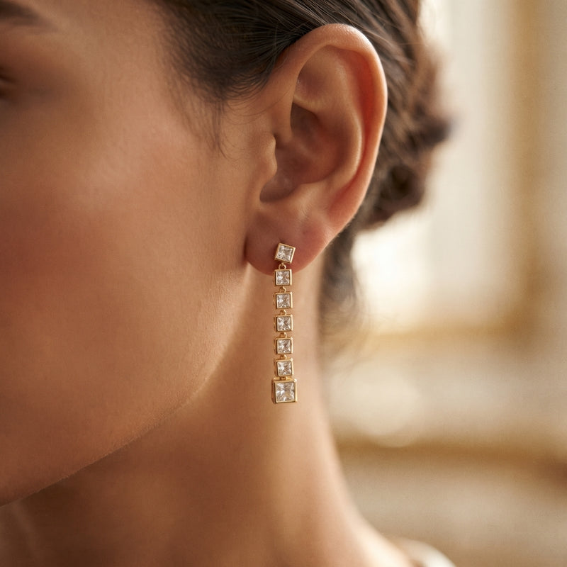 Gold bezel-set square CZ linear drop earrings