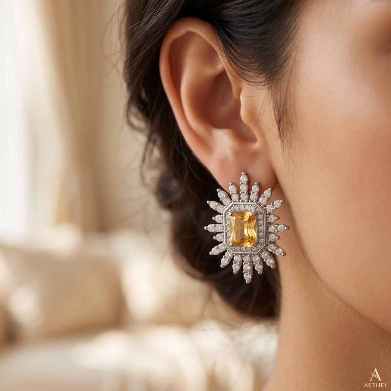 Silver CZ starburst studs, emerald-cut champagne centre