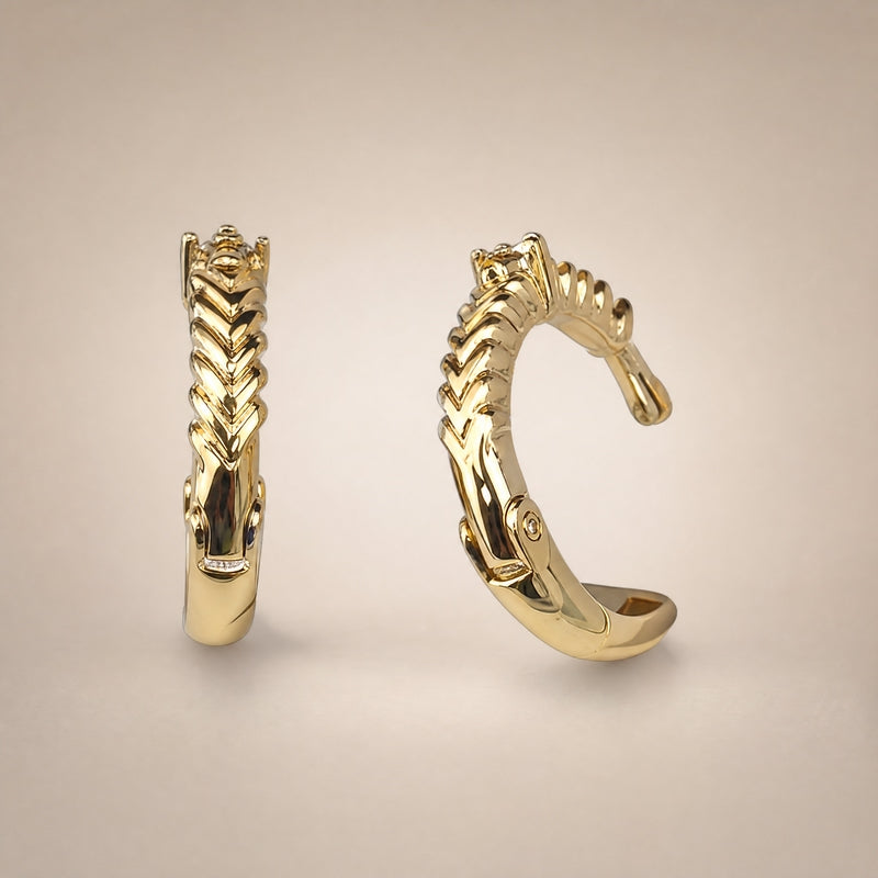 Gold laurel-braid C-hoop huggies with CZ accent