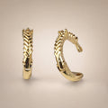 Gold laurel-braid C-hoop huggies with CZ accent