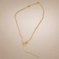 Gold CZ tennis lariat necklace, pavé buckle-hook drop
