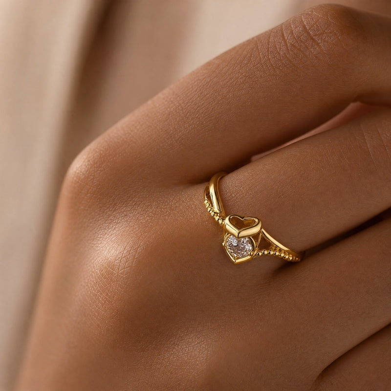 Gold heart-motif ring, CZ solitaire, twisted pavé band