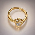 Gold heart-motif ring, CZ solitaire, twisted pavé band