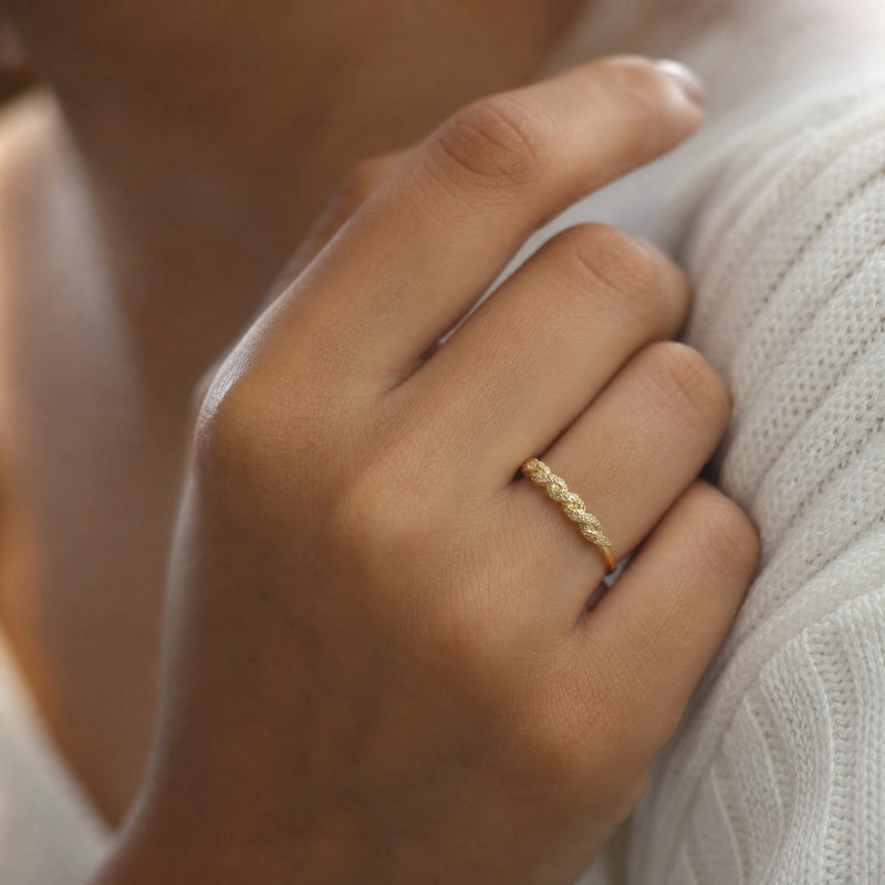 Gold thin-band ring, CZ pavé twisted half-eternity front