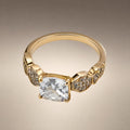 Gold solitaire ring, cushion-cut CZ, pavé shoulders