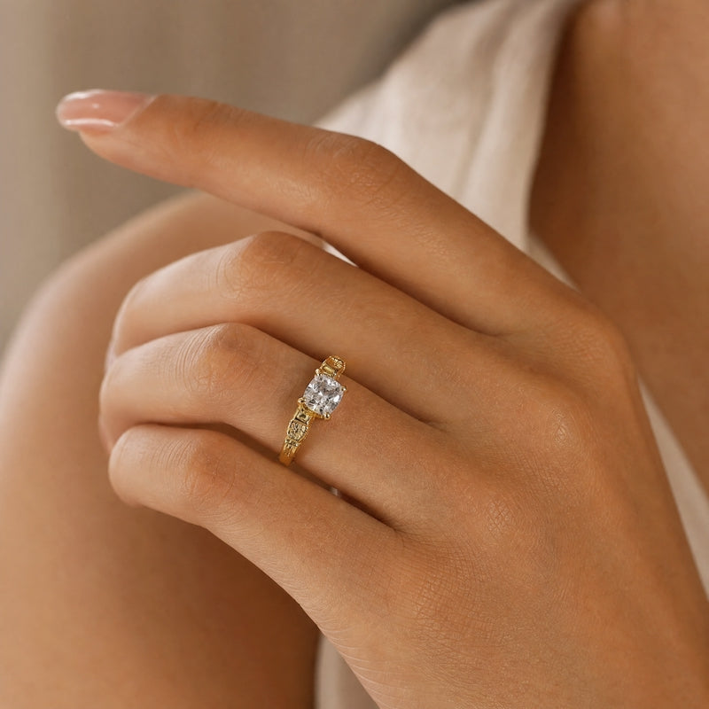 Gold solitaire ring, cushion-cut CZ, pavé shoulders