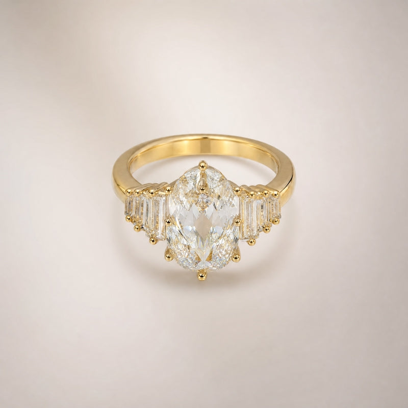 Gold statement ring, large oval CZ, stepped baguette shoulders