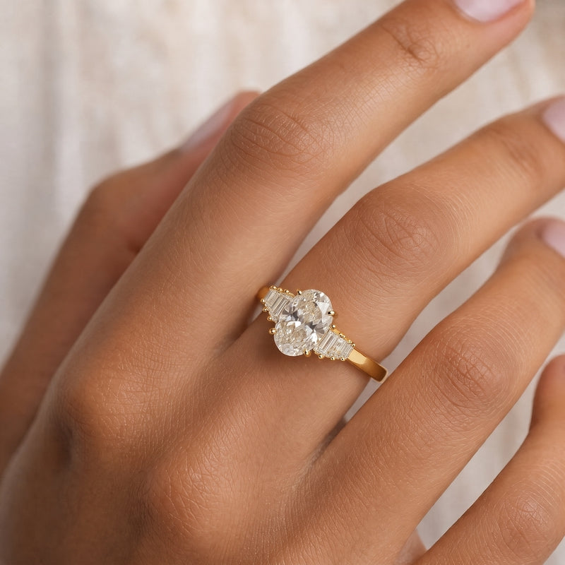 Gold statement ring, large oval CZ, stepped baguette shoulders