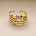 Gold open multi-row ring, scattered bezel-set CZs