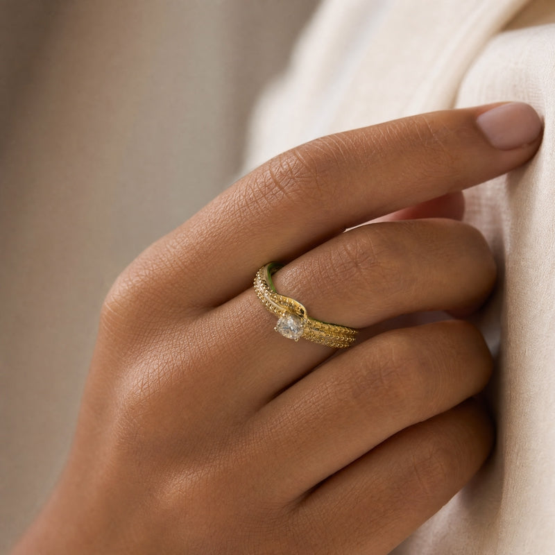 Gold crossover ring, round CZ solitaire, pavé split band